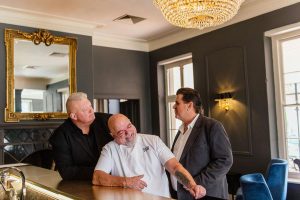 Rugby legend Kobus Wiese, of Wiese Coffee Holdings, and celebrity Chef Pete Goffe-Wood of Viande restaurant at the Grande Roche hotel in Paarl, with owner Hansie Britz